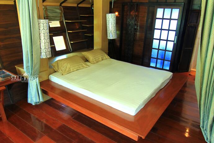 Imagen de la habitación del Hotel The Sali-Kham Traditional Lanna Home. Foto 11