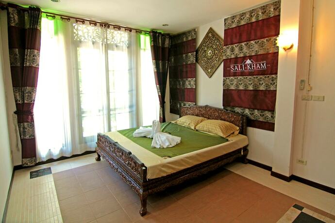 Imagen de la habitación del Hotel The Sali-Kham Traditional Lanna Home. Foto 12