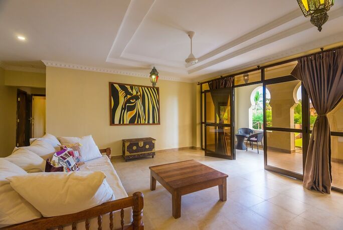 Imagen de la habitación del Hotel The Sands Beach Resort Zanzibar. Foto 14