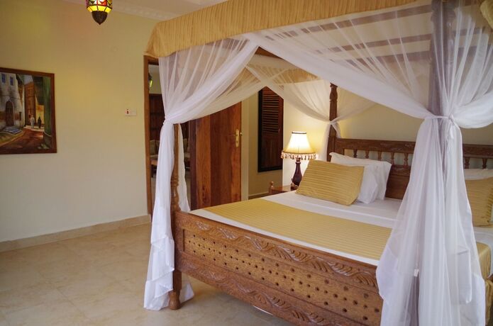 Imagen de la habitación del Hotel The Sands Beach Resort Zanzibar. Foto 19