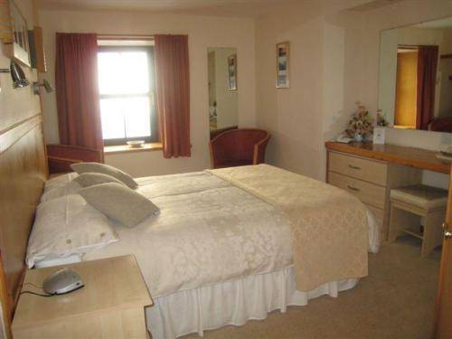 Imagen de la habitación del Hotel The Sands. Foto 6