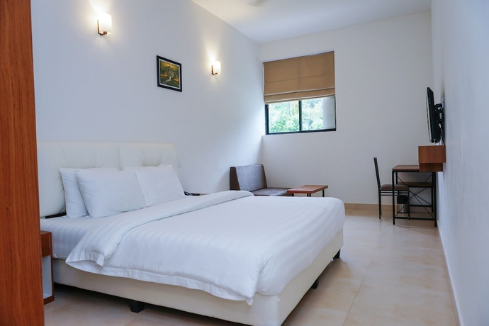 Imagen de la habitación del Hotel The Sanihara. Foto 14