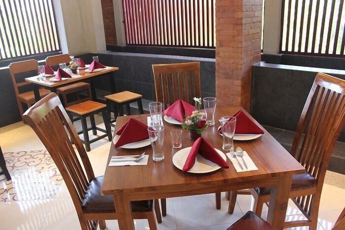 Imagen del bar/restaurante del Hotel The Sarining. Foto 7
