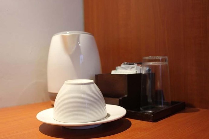 Imagen de la habitación del Hotel The Sarining. Foto 16