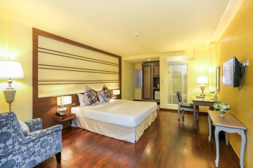 Imagen de la habitación del Hotel The Sathon Vimanda. Foto 11