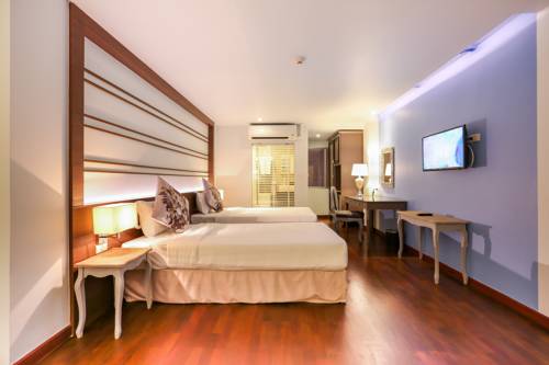 Imagen de la habitación del Hotel The Sathon Vimanda. Foto 15