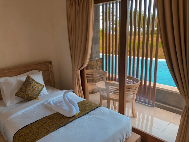 Imagen de la habitación del Hotel The Sawah Resort and Villa. Foto 17