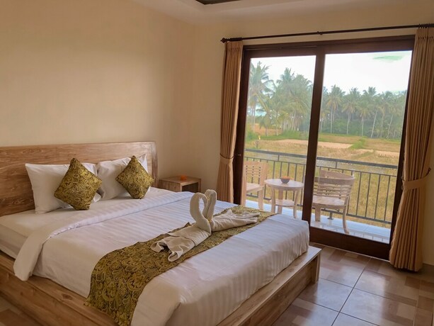 Imagen de la habitación del Hotel The Sawah Resort and Villa. Foto 28