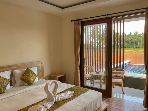 Imagen de la habitación del Hotel The Sawah Resort and Villa. Foto 30