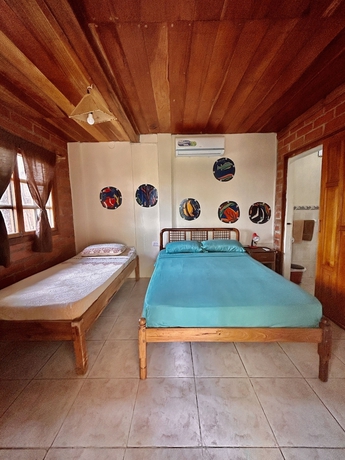 Imagen de la habitación del Hotel The Sea Garden House. Foto 4