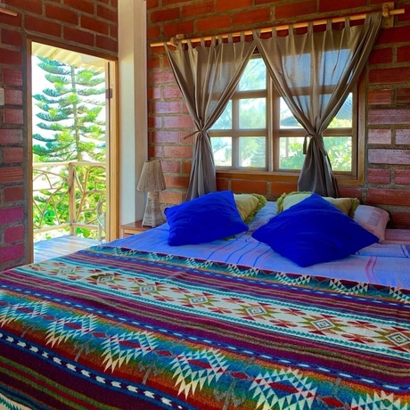 Imagen de la habitación del Hotel The Sea Garden House. Foto 8