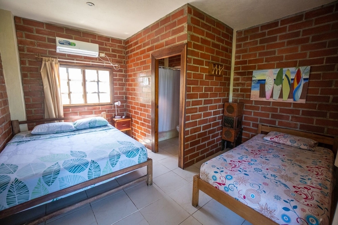 Imagen de la habitación del Hotel The Sea Garden House. Foto 10