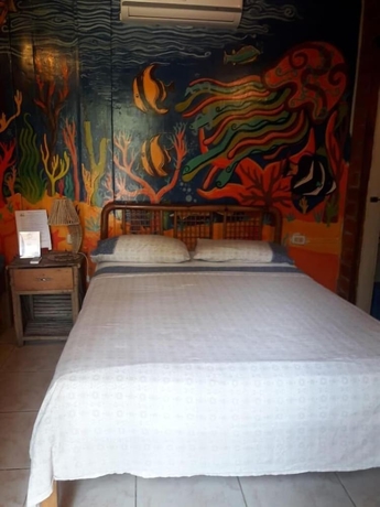 Imagen de la habitación del Hotel The Sea Garden House. Foto 17