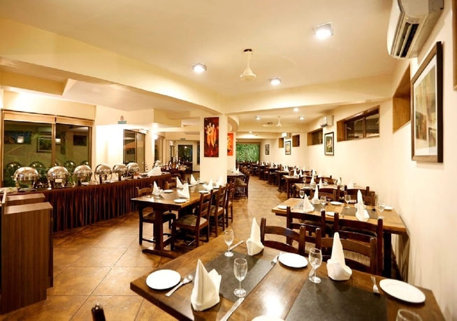 Imagen del bar/restaurante del Hotel The Sea Horse Resort. Foto 3