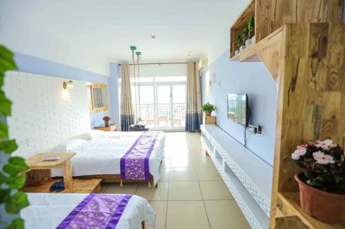 Imagen de la habitación del Hotel The Sea Resort Sanya Seaview Inn. Foto 1