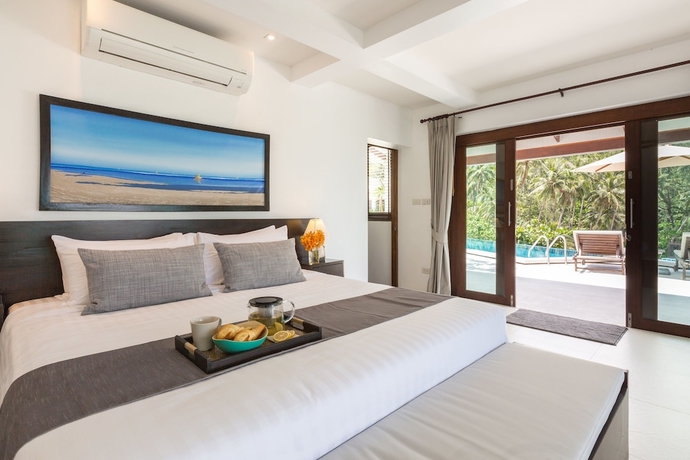 Imagen de la habitación del Hotel The Secret Beach Villa. Foto 6