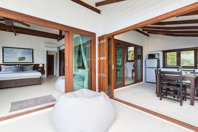 Imagen de la habitación del Hotel The Secret Beach Villa. Foto 15