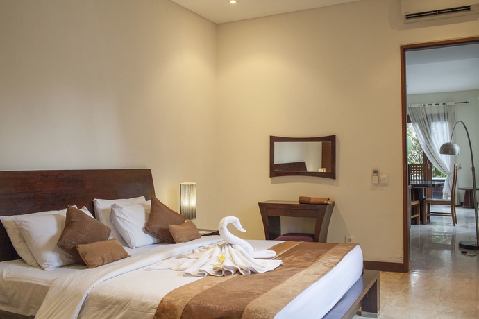 Imagen de la habitación del Hotel The Segara Suites. Foto 7