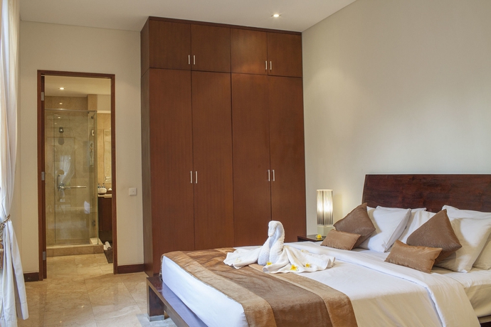 Imagen de la habitación del Hotel The Segara Suites. Foto 8
