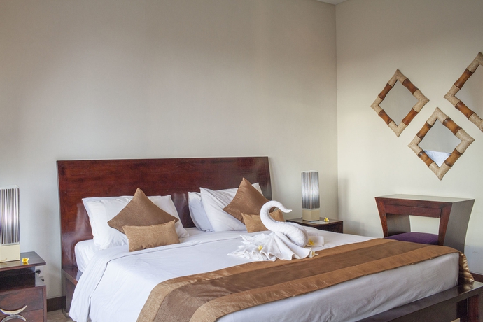 Imagen de la habitación del Hotel The Segara Suites. Foto 9