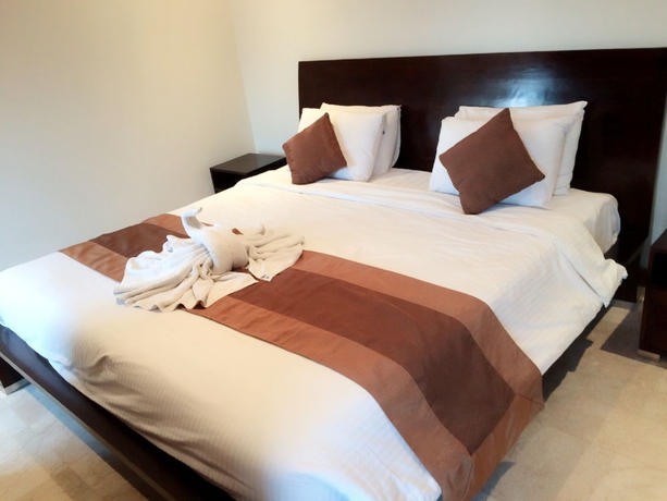 Imagen de la habitación del Hotel The Segara Suites. Foto 10