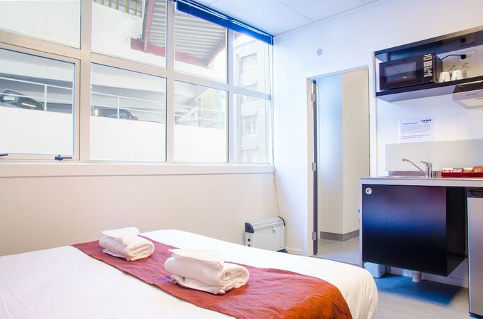 Imagen de la habitación del Hotel The Setup On Manners Serviced Apartments. Foto 10