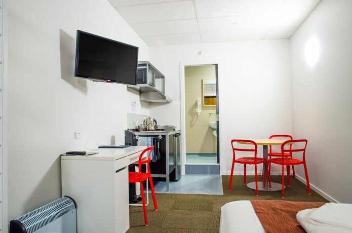 Imagen de la habitación del Hotel The Setup On Manners Serviced Apartments. Foto 11