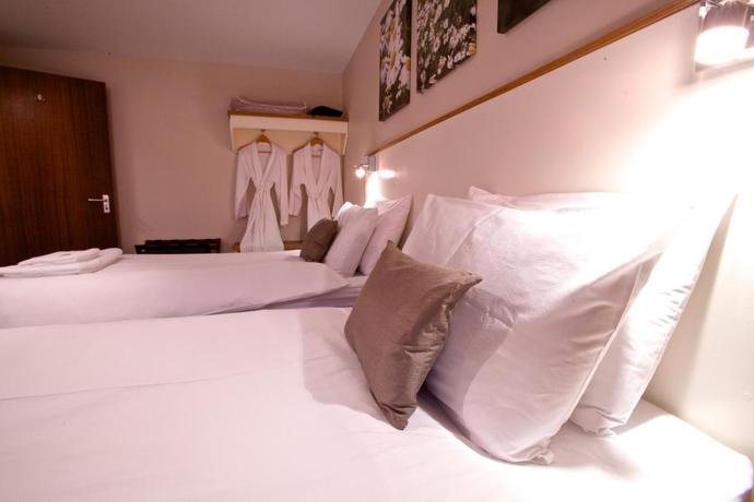 Imagen de la habitación del Hotel The Shore. Foto 8