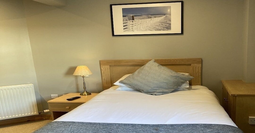 Imagen de la habitación del Hotel The Sleepwell Inn. Foto 14