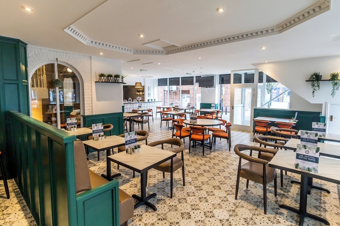 Imagen del bar/restaurante del Hotel The Sleepwell Inn. Foto 7