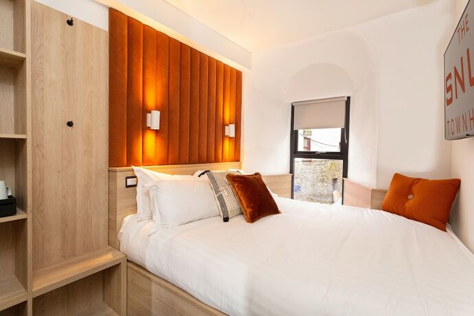 Imagen de la habitación del Hotel The Snug Townhouse. Foto 14