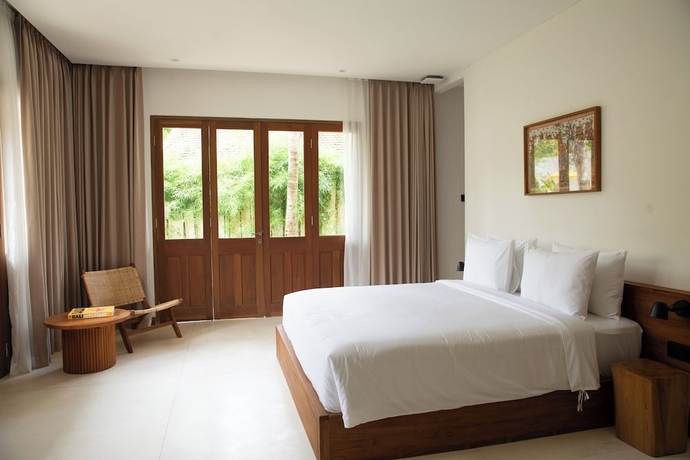 Imagen de la habitación del Hotel The Soko Bali. Foto 2