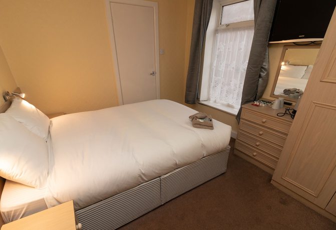 Imagen de la habitación del Hotel The Starlux. Foto 6