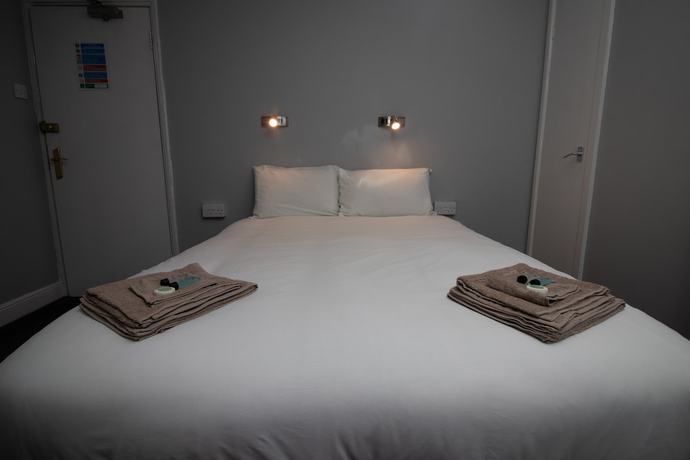 Imagen de la habitación del Hotel The Starlux. Foto 9