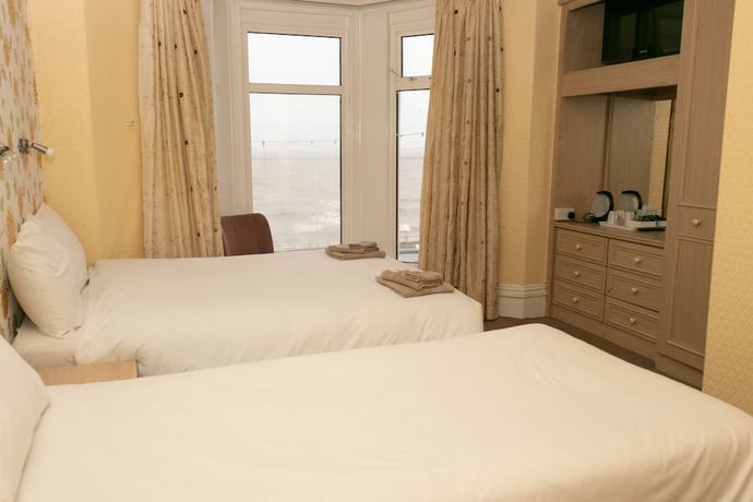 Imagen de la habitación del Hotel The Starlux. Foto 16