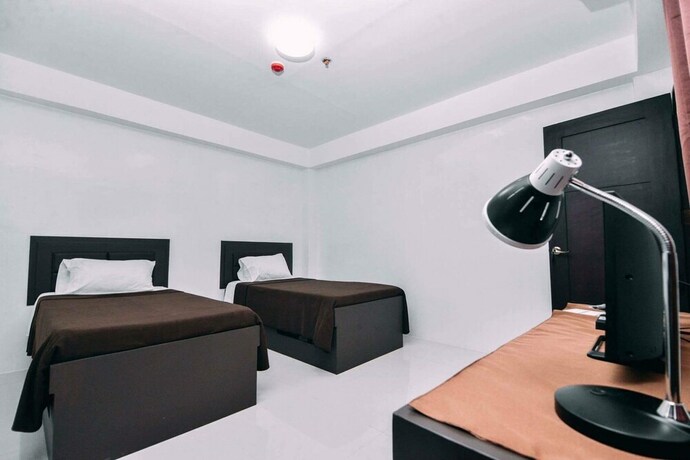 Imagen de la habitación del Hotel The Strand Suites and Dormitel. Foto 24