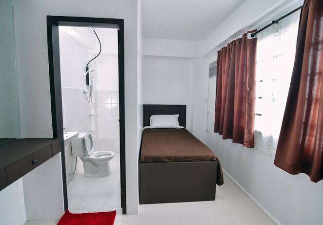 Imagen de la habitación del Hotel The Strand Suites and Dormitel. Foto 25