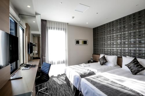Imagen de la habitación del Hotel The Strings Nagoya. Foto 7