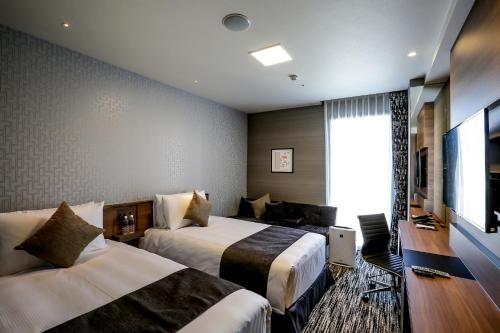 Imagen de la habitación del Hotel The Strings Nagoya. Foto 8