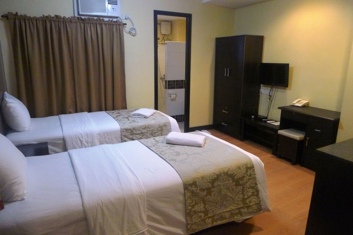 Imagen de la habitación del Hotel The Studio 18 Residences. Foto 7