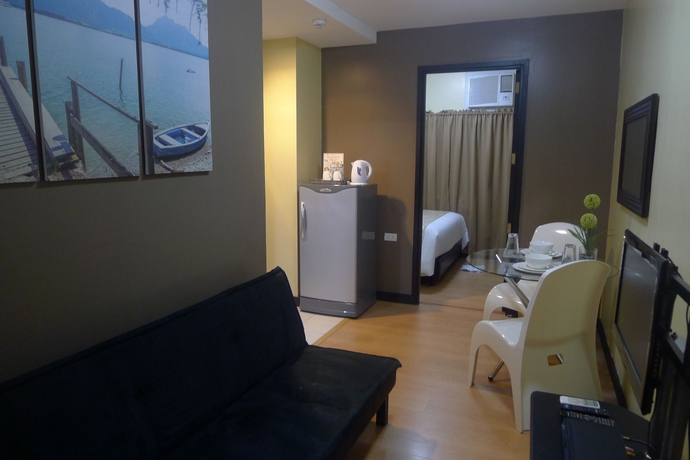 Imagen de la habitación del Hotel The Studio 18 Residences. Foto 9