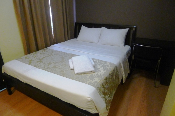 Imagen de la habitación del Hotel The Studio 18 Residences. Foto 12