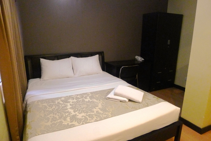 Imagen de la habitación del Hotel The Studio 18 Residences. Foto 14