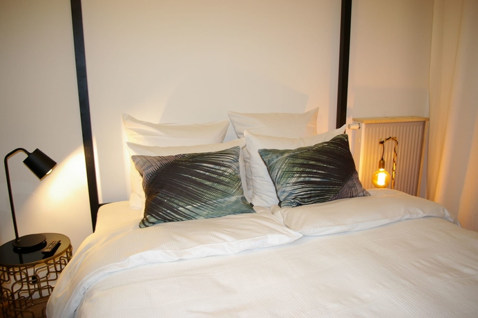 Imagen de la habitación del Hotel The Suite Fabric. Foto 7