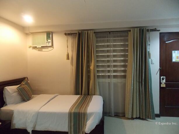 Imagen de la habitación del Hotel The Suites At Calle Nueva. Foto 11