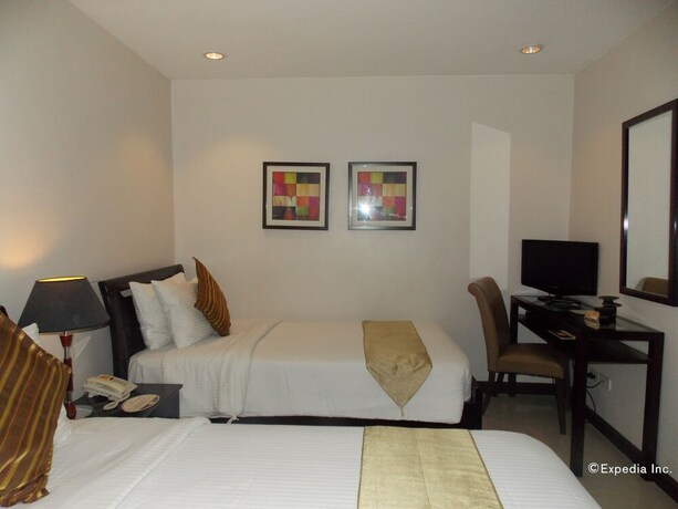 Imagen de la habitación del Hotel The Suites At Calle Nueva. Foto 13