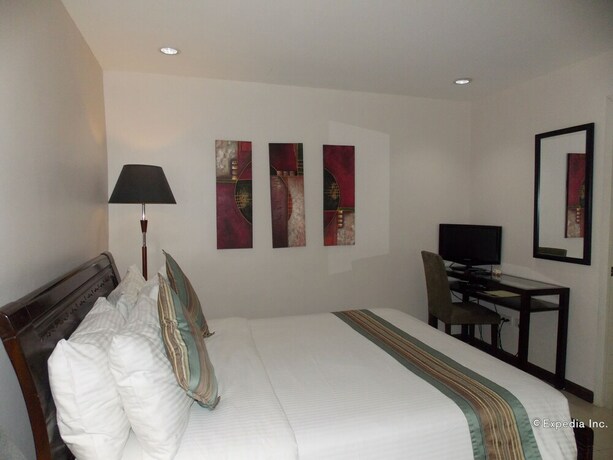 Imagen de la habitación del Hotel The Suites At Calle Nueva. Foto 14