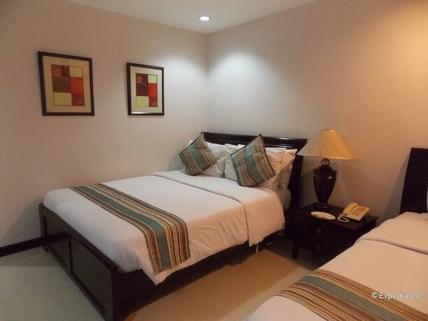 Imagen de la habitación del Hotel The Suites At Calle Nueva. Foto 15