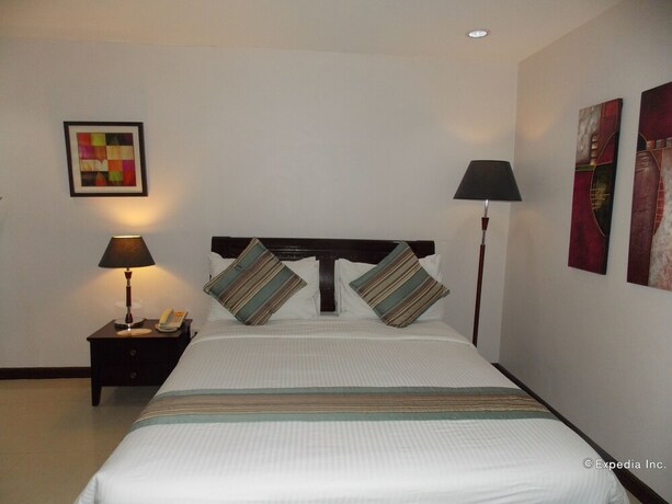 Imagen de la habitación del Hotel The Suites At Calle Nueva. Foto 17