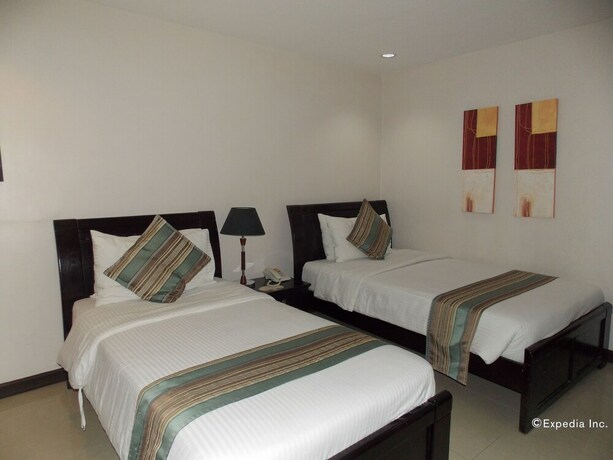 Imagen de la habitación del Hotel The Suites At Calle Nueva. Foto 18